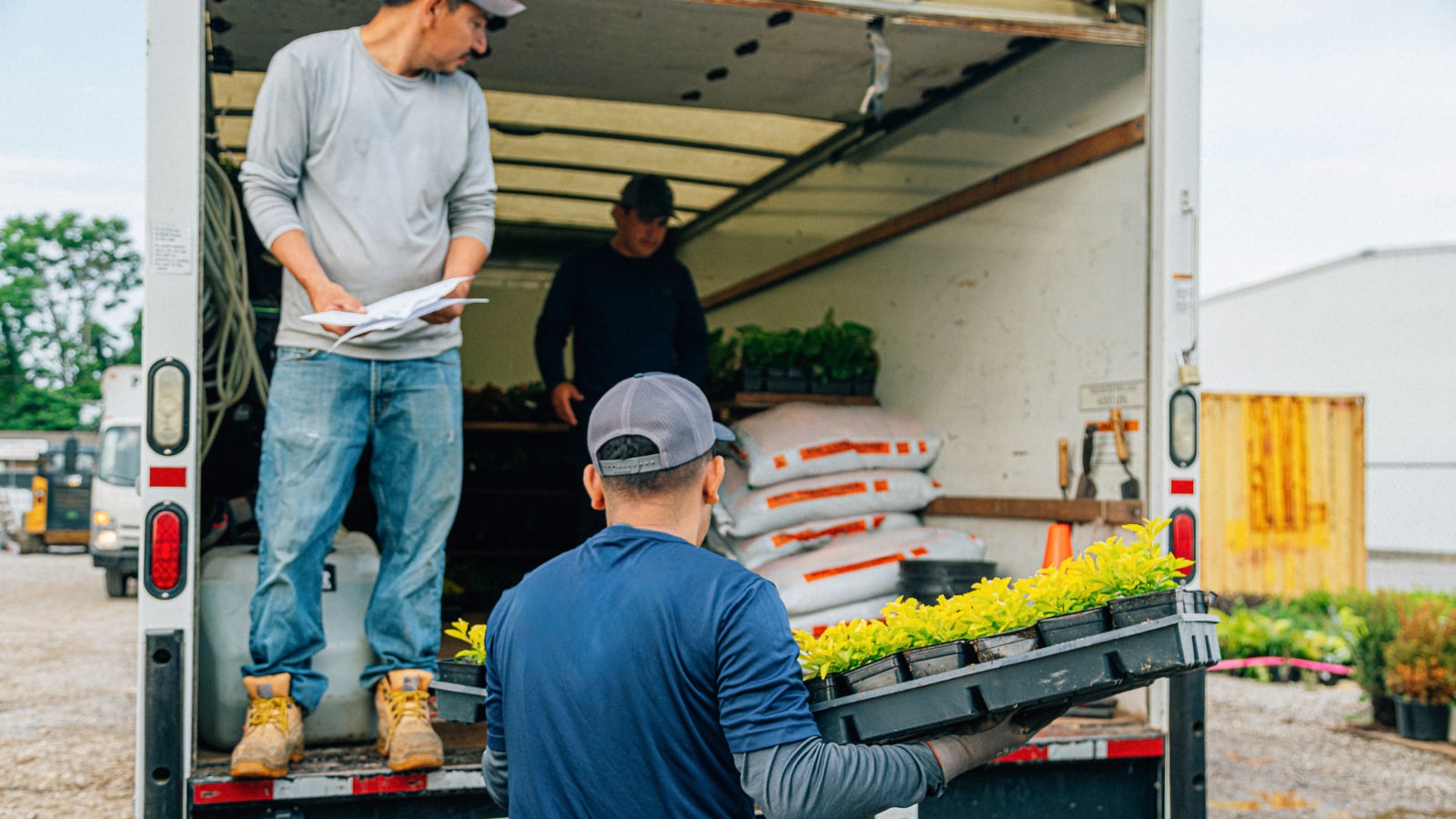 April 4 blog Team of landscapers unloading truck